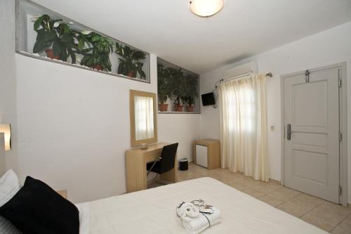 Katil atau katil-katil dalam bilik di Zannis Hotel