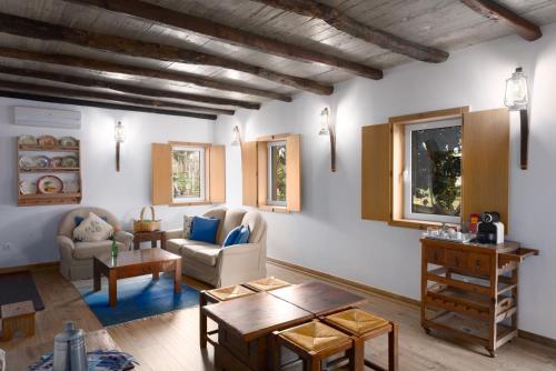 a living room with a couch and a table at Casa De Santo Antão - Turismo Rural in Padrões