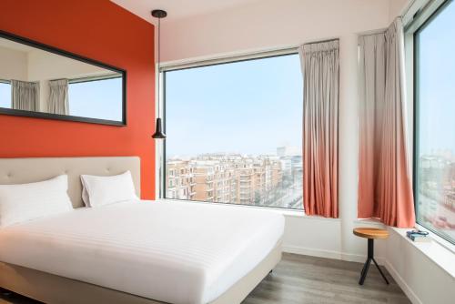 Postel nebo postele na pokoji v ubytování Adagio Paris 19ème Cité de la Musique