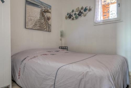 Ένα ή περισσότερα κρεβάτια σε δωμάτιο στο Appartement Le Flamant Rose