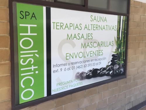 a sign in a window of a pharmacy at Best Western PLUS Plaza Florida & Tower in Irapuato