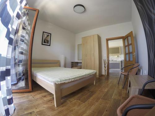 a bedroom with a bed and a mirror at Complex Adria Montenegro in Herceg-Novi