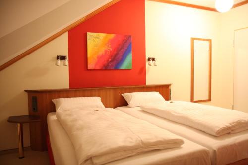 
Ein Bett oder Betten in einem Zimmer der Unterkunft Hotel Deutsches Haus
