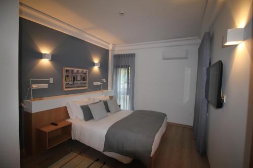 Katil atau katil-katil dalam bilik di Imperador Hotel