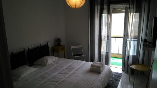 Postel nebo postele na pokoji v ubytování Vasco Santana Guesthouse