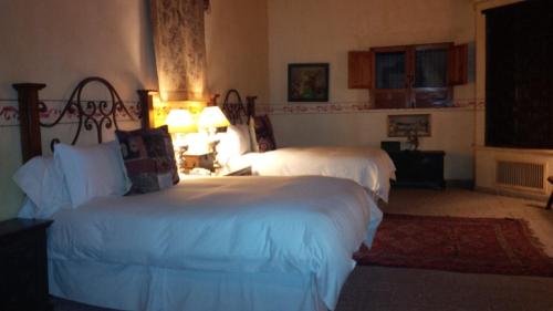 Ein Bett oder Betten in einem Zimmer der Unterkunft Hacienda de los Santos
