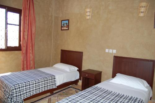Postel nebo postele na pokoji v ubytování Auberge Amellagou