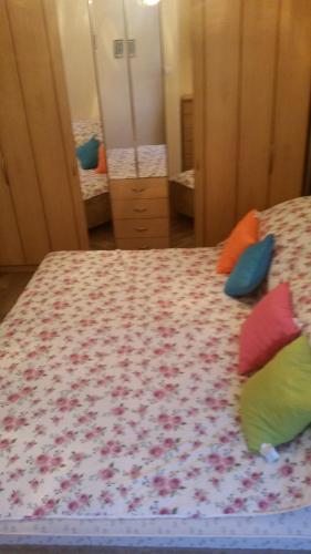 a bedroom with a bed with two pillows on it at Alina in Giżycko