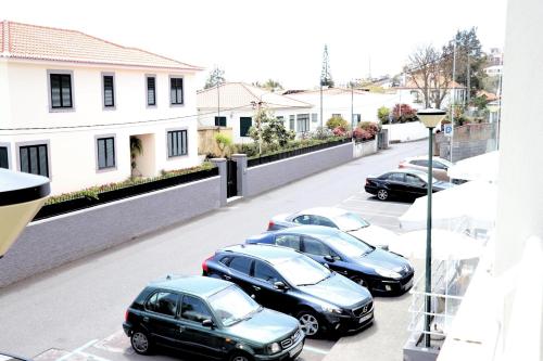 a group of cars parked in a parking lot at Mericia's Gorgeous View in Funchal