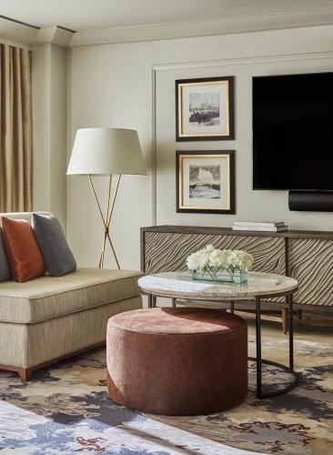 a living room with a couch and a table at Four Seasons Hotel Austin in Austin