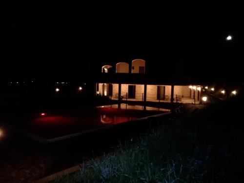 a building at night with lights in the dark at B&B CasalFarano in Cupra Marittima