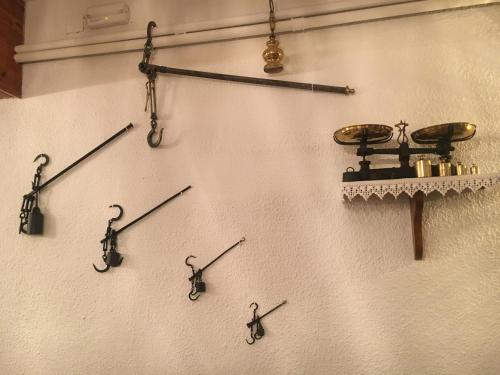 a wall with different types of hooks on it at Hotel Marxant in Tavascan