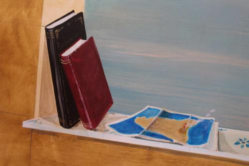 a suitcase sitting on a shelf next to a painting at Catarin Comfort Rooms in Castelluzzo