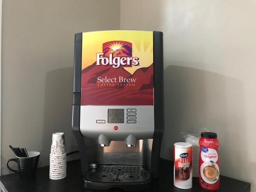 a coffee machine with a box on a counter at Hotel Lexihill in Lexington
