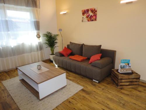 a living room with a couch and a coffee table at Gasthof Reiterstuben in Hoßkirch