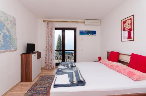 Posteľ alebo postele v izbe v ubytovaní Apartments and Room Luka