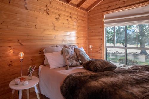 A bed or beds in a room at White Croft Cottage