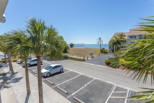 a car parked in a parking lot with palm trees at TAMPA BAY, BEACH step away, WIFI, FREE PARKING,POOLS, JACUZZI in Ruskin