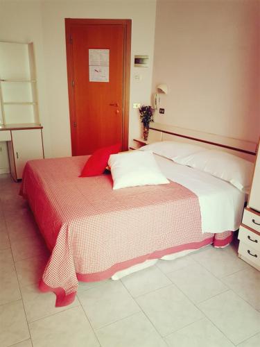 Postel nebo postele na pokoji v ubytování Hotel Giannella