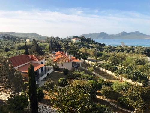 a villa with a view of the ocean at Blue Fort Villas in Methoni