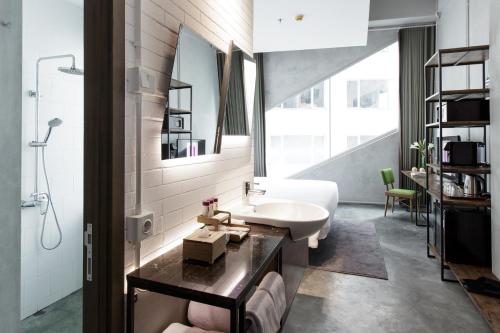 a bathroom with a sink and a mirror at Janevalla Bandung in Bandung