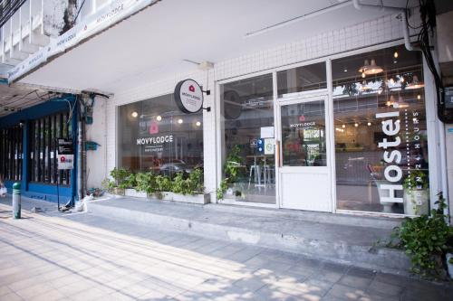 a store front of a building with a storefront at Movylodge in Bangkok