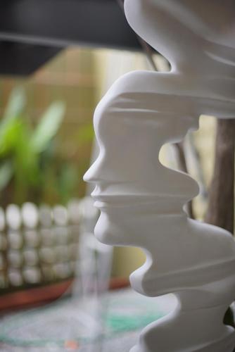 a white object sitting on a table with a keyboard at Gategaa Village in Chiang Mai