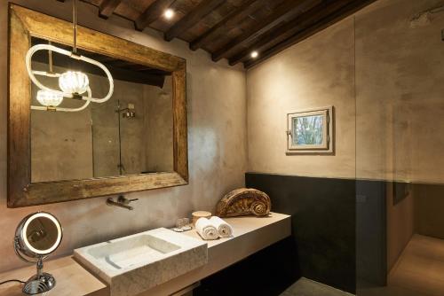 a bathroom with a sink and a mirror at Riva Lofts Florence in Florence