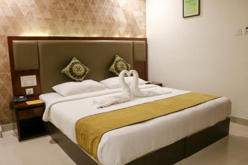 Een bed of bedden in een kamer bij Hotel Winsar Park