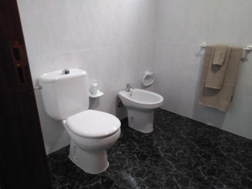 a bathroom with a toilet and a bidet at Toni's in Arinaga
