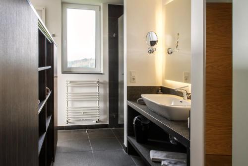 
A bathroom at BURGHOF - DAS HOTEL
