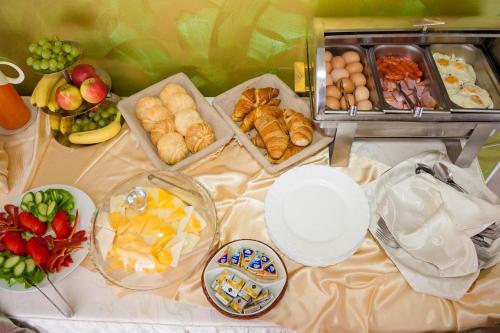 a table with many different types of food on it at Hotel Corvaris in Bucharest