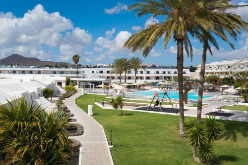 a view of the resort with a playground at Apartamentos Santa Rosa in Costa Teguise