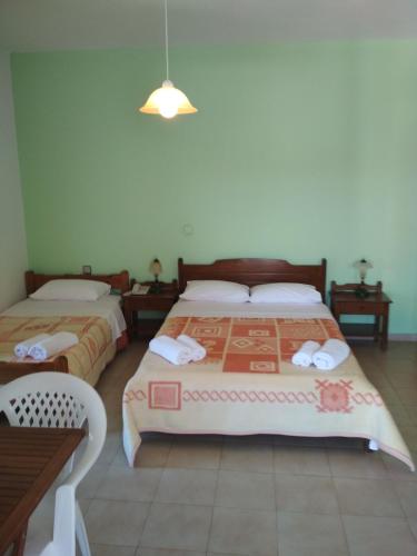 Postel nebo postele na pokoji v ubytování Flamingo Apartments