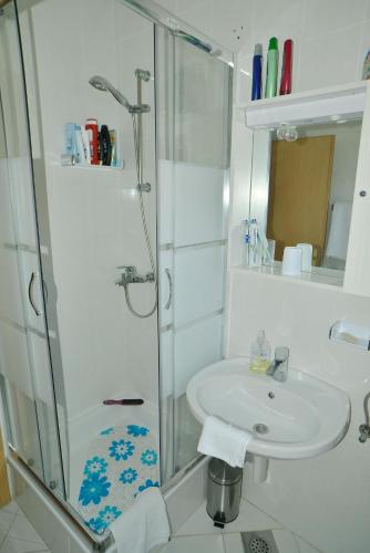 a bathroom with a sink and a shower at Barać in Kaštela