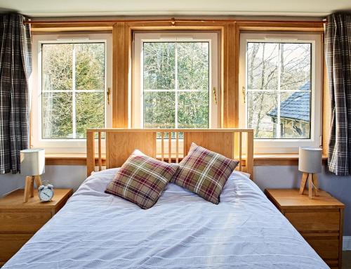 מיטה או מיטות בחדר ב-Glenalbyn Cottage