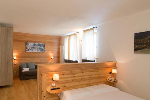 Postel nebo postele na pokoji v ubytování Sport Hotel Prodongo