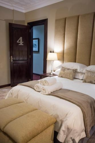 Ένα ή περισσότερα κρεβάτια σε δωμάτιο στο Border Hotel