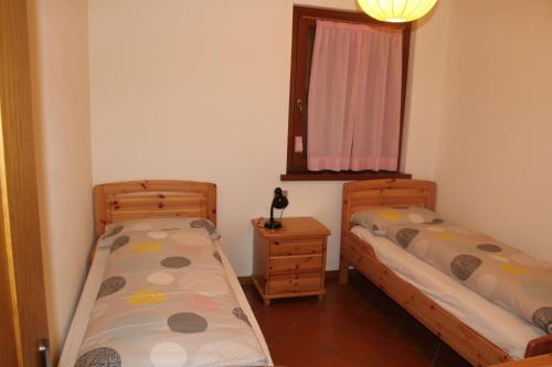 Posteľ alebo postele v izbe v ubytovaní Casa Pienzi
