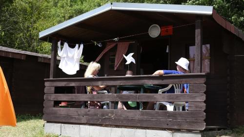 a group of people sitting in a play house at Chatky-Bítov 399 in Bítov