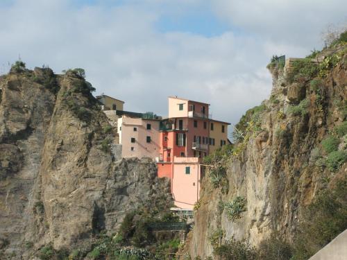 a house on the side of a mountain at Nibea Suite Apartment in Manarola