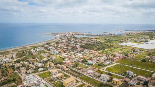 an aerial view of a city next to the ocean at La Villa delle Spezie in Marzamemi