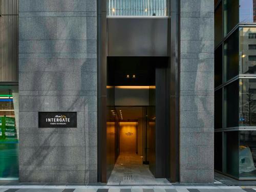 an entrance to a building with a sign on it at Hotel Intergate Tokyo Kyobashi in Tokyo