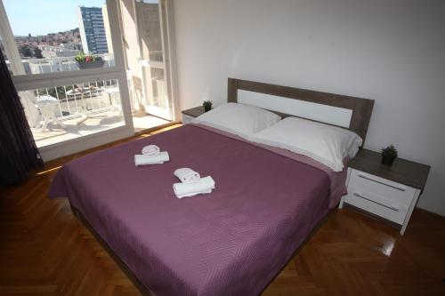 Łóżko lub łóżka w pokoju w obiekcie Apartment Vesna