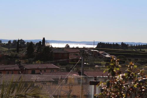 a view of a town with houses and the ocean at Hotel La Dolce Vita in Cavaion Veronese