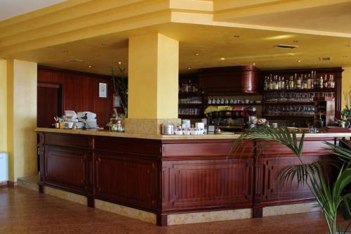 a large wooden bar in a hotel room at Hotel La Dolce Vita in Cavaion Veronese