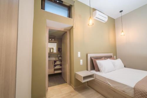Postel nebo postele na pokoji v ubytování Amarantos House