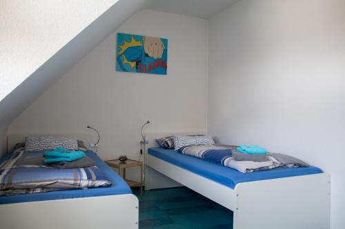 מיטה או מיטות בחדר ב-Ferienwohnung Weiher - Nähe Nürnberg / Messe