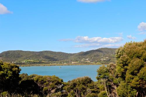 a view of a lake with mountains in the background at Russell-Orongo Bay Holiday Park in Russell