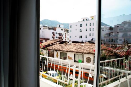 a view of a city from a window at Hotel Rio Malecon in Puerto Vallarta